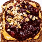 Whole-Grain Toast Topped With Nut Butter For Blue Machine Smoothie